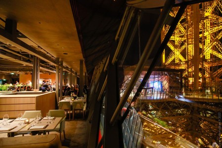 Night view of the Eiffel Tower structure from Madame Brasserie