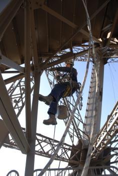 A painter on the Eiffel Tower