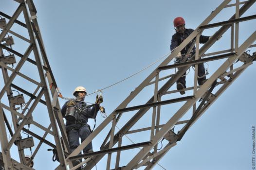 Two painters on the Eiffel Tower